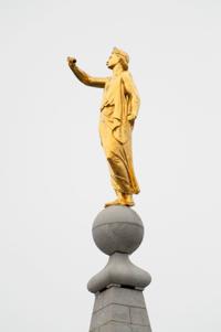 The Angel Moroni statue’s outstretched hand appears empty after the trumpet held by the figure, on top of the Mormon Salt Lake Temple, toppled during a 5.7 magnitutude earthquake in Salt Lake City, Utah, U.S. March 18, 2020